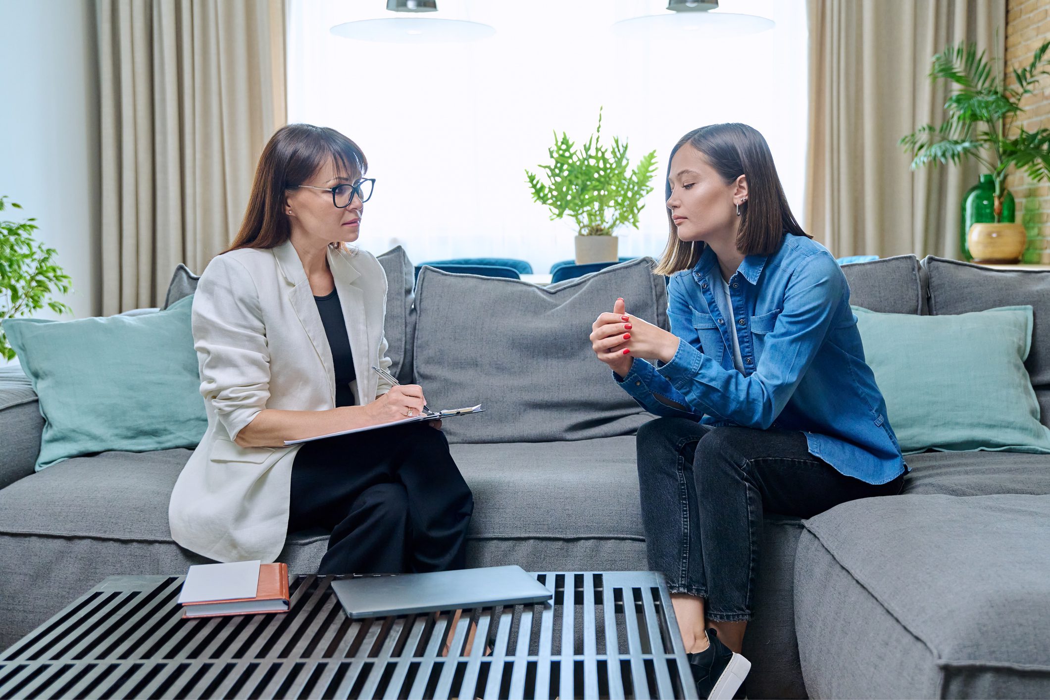 Two women having a serious conversation.