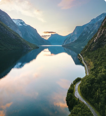 Serene fjord landscape with winding road.