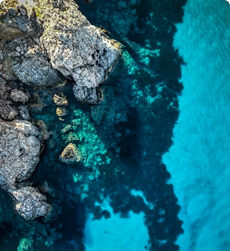 Rocky coastline with clear turquoise water.